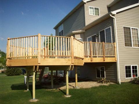 Traditional Deck with white framed windows and doors