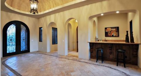 Traditional Entry with french doors with wrought iron detailing