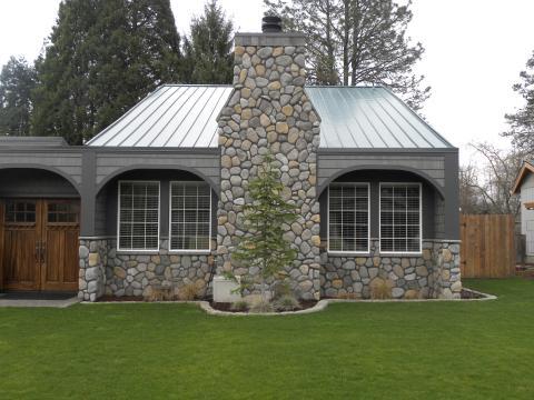 Transitional Home Exterior with tall wooden privacy fence
