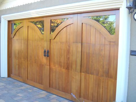 Traditional Garage with corner windows in garage door