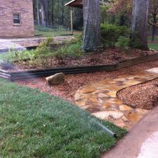 Eclectic Landscape with wood log garden border