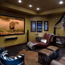 Traditional Home Theater with leather bucket chairs with zebra print