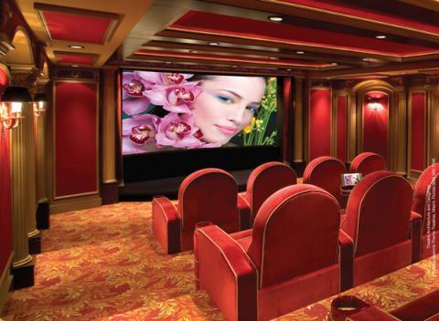 Traditional Home Theater with red and gold floral carpeting