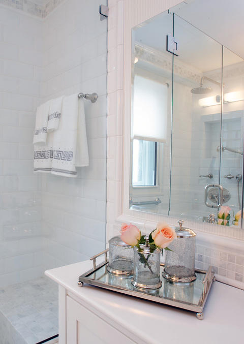 Transitional Bathroom with silver tray with glass canisters