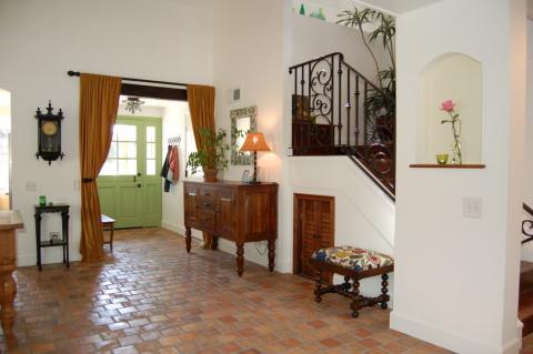 Eclectic Entry with small hallway stool with beaded legs
