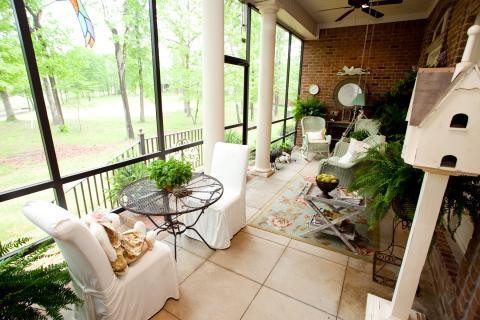 Traditional Sunroom with pale blue wicker furniture