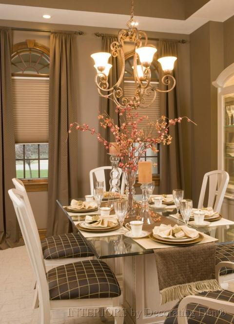 Traditional Dining Room with glass vase with dried sticks center piece