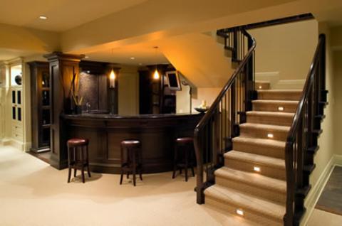 Transitional Basement with dark wood red leather bar stools