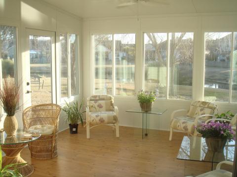 Traditional Sunroom with glass top occasional tables