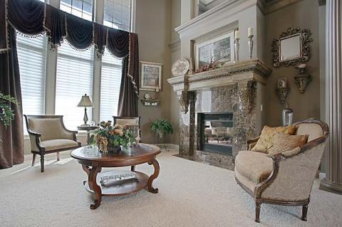 Traditional Family Room with medium wood round top coffee table