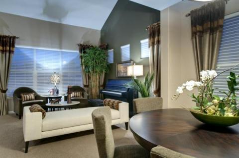 Contemporary Family Room with dark gray painted accent wall