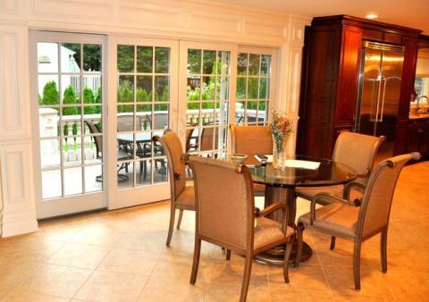 Traditional Dining Room with white detailed wooden trims around it