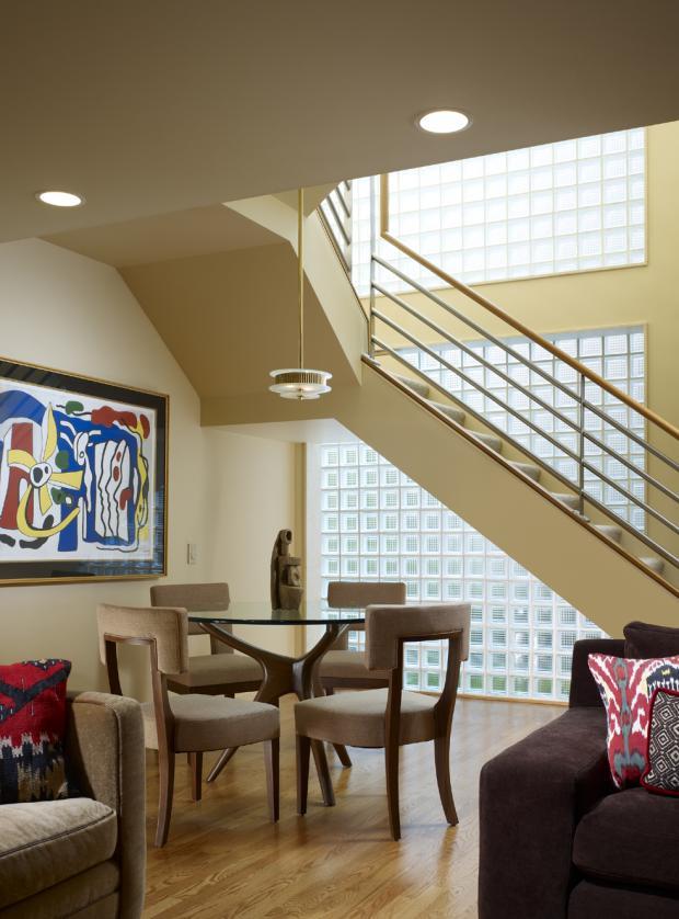 Modern Dining Room with cushioned brown dining table
