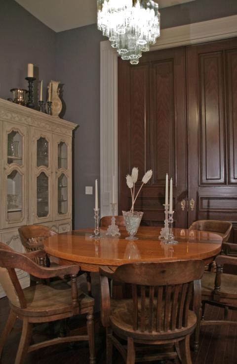 Eclectic Dining Room with round wooden dining table