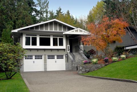Contemporary Garage with white garage doors with glass panels