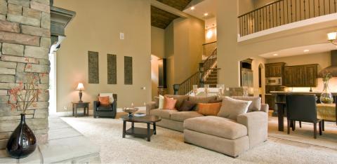 Contemporary Family Room with dark wood circle coffee table with shelve below