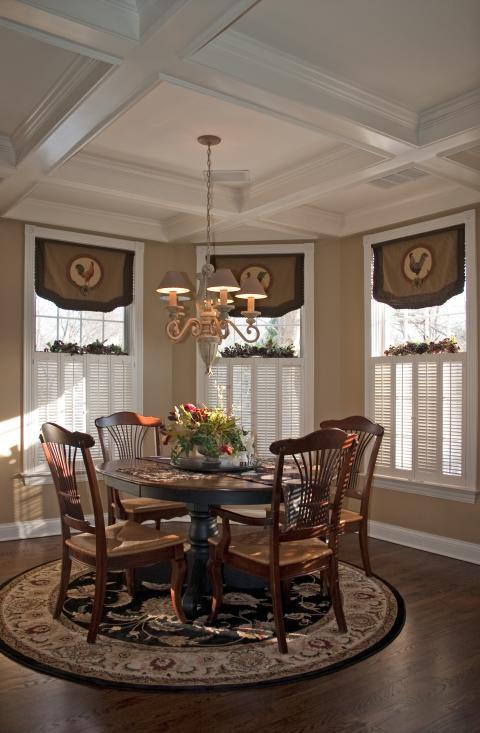 Traditional Dining Room with dark wood dining table and chairs