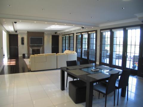 Transitional Dining Room with black framed windows and doors