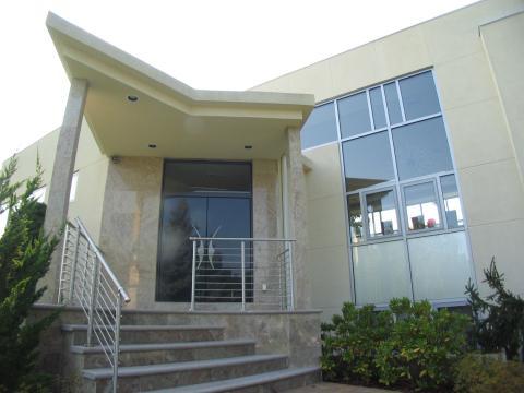 Modern Home Exterior with marble tile entrance facade