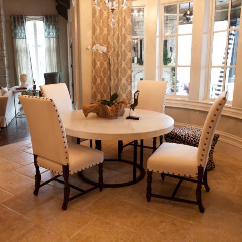Eclectic Dining Room with white upholstered chairs
