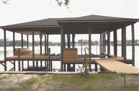 Modern Landscape with covered boat dock and deck