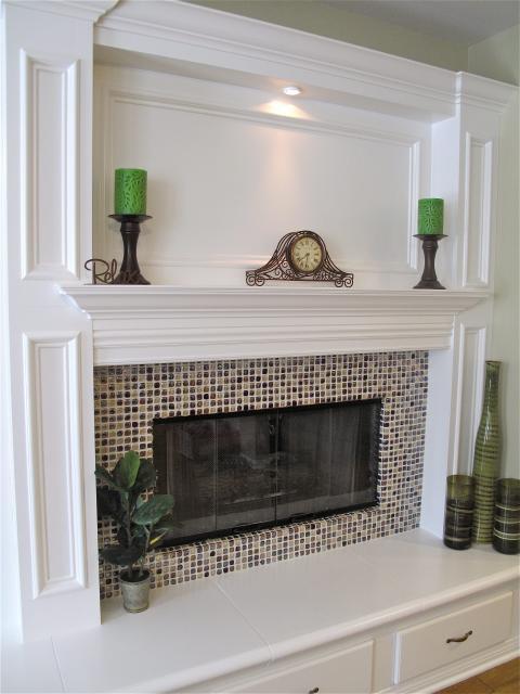 Traditional Family Room with small brown and tan tile fire place facing