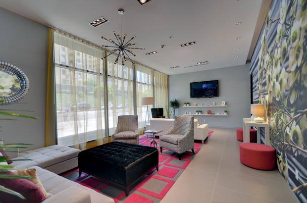 Mid-Century Modern Family Room with black crushed velvet upholstered ottoman