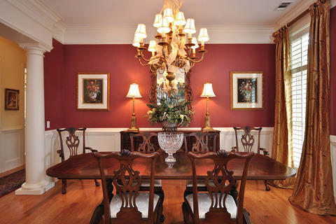 Traditional Dining Room with dark wood dining table and chairs
