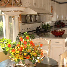 Transitional Dining Room with white and black tile back splash