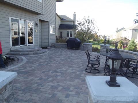 Traditional Patio with black lantern style pillar lighting