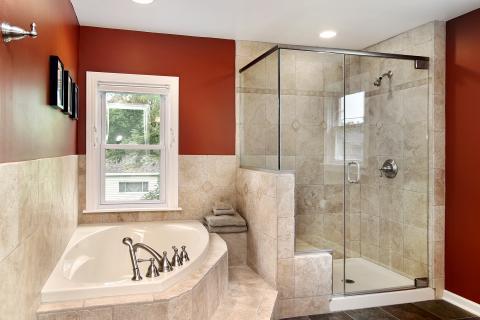 Traditional Bathroom with shower head in the bath tub
