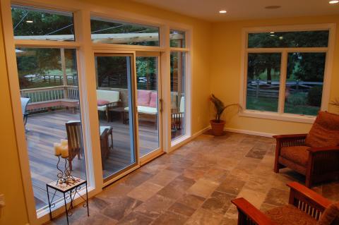 Traditional Sunroom with small side table with candle holders