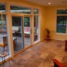 Traditional Sunroom with small side table with candle holders