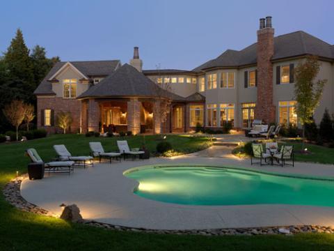 Traditional Pool with white cushion lounge chairs