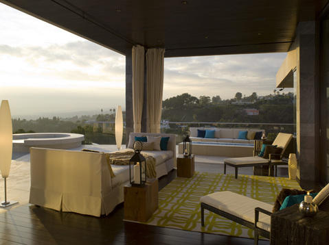 Contemporary Patio with house on hill over looking water