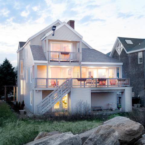 Eclectic Home Exterior with white framed windows and doors