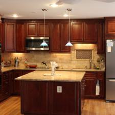 Traditional Kitchen with dark cherry wood kitchen cabinets