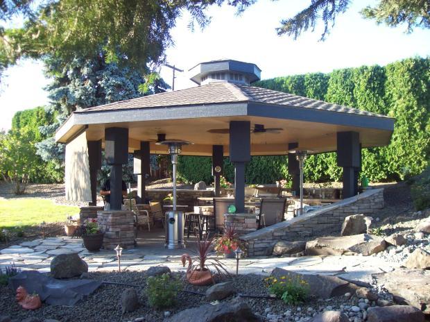 Southwestern Outdoor Kitchen with black painted support beams