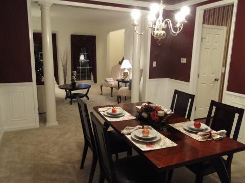 Traditional Dining Room with dark wood dining table and chairs