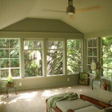 Traditional Sunroom with soft green painted walls