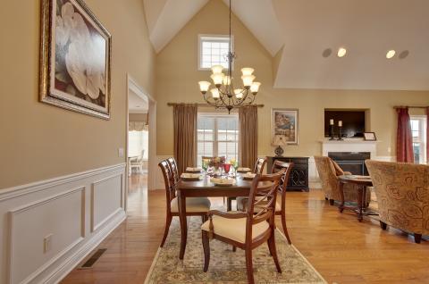 Traditional Dining Room with wooden dining chairs with cushions