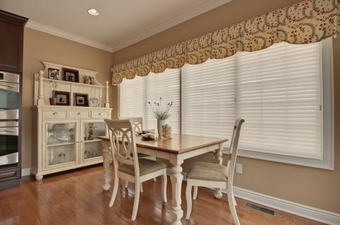 Traditional Dining Room with white wood dining table with medium wood surface