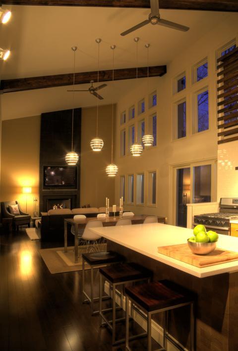 Contemporary Family Room with long dark wood dining table with silver legs