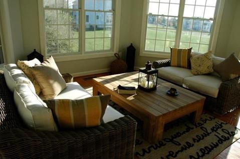 Eclectic Sunroom with large white framed windows