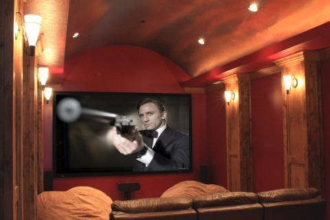 Traditional Home Theater with burgundy painted walls