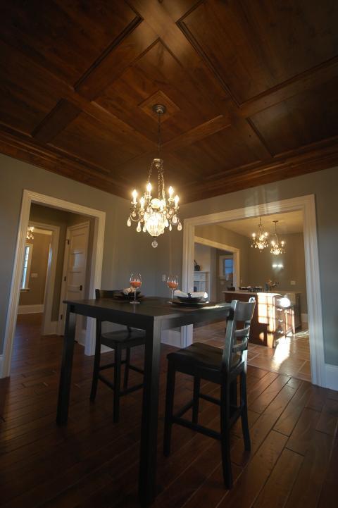 Traditional Dining Room with dark wood crown moulding
