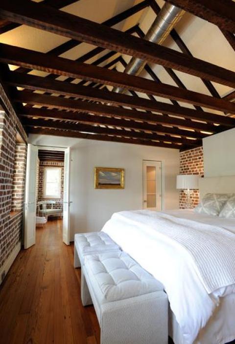 Eclectic Bedroom with white upholstered bench