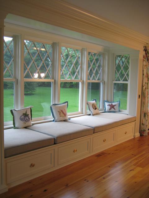 Traditional Living Room with large window seating bench