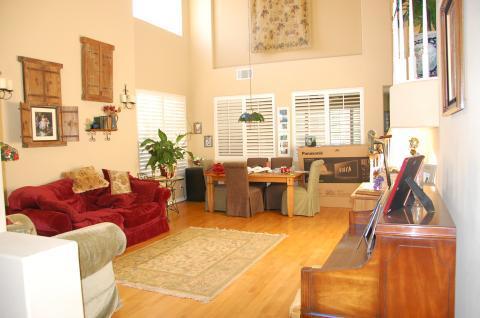 Eclectic Family Room with two story vaulted ceiling