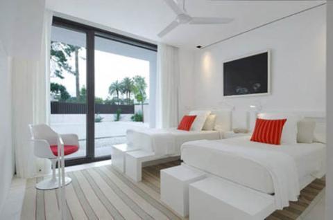 Modern Bedroom with red stripped accent pillow